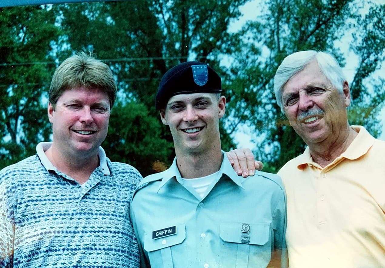 Bradley Griffin in Army dress uniform and beret, flanked by his father and grandfather on graduation day